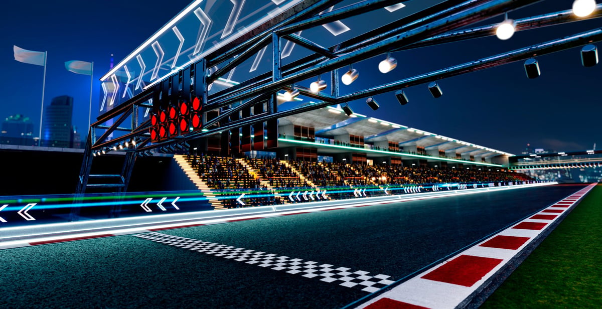 Racetrack starting grid with lights and grandstands at night, anticipating a speed event. 3d rendering